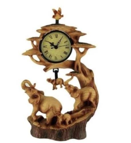 Overview Cleverly cast in resin with intricately sculpted detail and a finish that mimics real wood grains and a bark texture around the base. This Elephant Family Clock has quartz movement further highlighted by the swinging elephant and bird pendulum in the background.